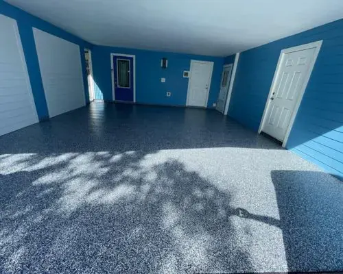 Finished flake garage floor in Brevard County with a polyaspartic topcoat